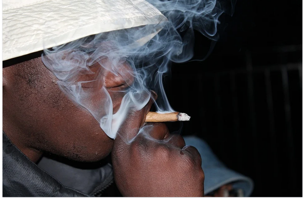 a man smoking marijuana